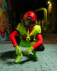 Phenom Elite TMNT Raphael Vapor-Stick football gloves lifestyle photo — athlete vibe shot wearing green Ninja Turtles gloves