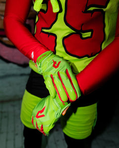 Phenom Elite TMNT Raphael football gloves lifestyle photo — green Vapor-Stick gloves on field