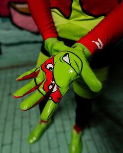 Phenom Elite TMNT Raphael football gloves lifestyle photo — green Vapor-Stick gloves action shot