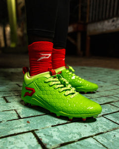 Phenom Elite Raphael football cleat lifestyle photo — athlete in action wearing cleats