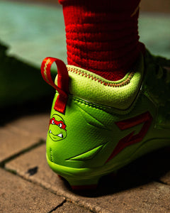 Phenom Elite Raphael football cleat lifestyle photo — game day shot