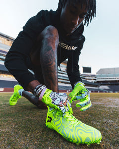 Phenom Elite x Rick and Morty VPS1 Vapor-Stick football gloves — lifestyle photo of athlete wearing slime green gloves