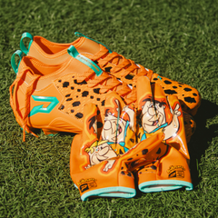Phenom Elite Flintstones football gloves lifestyle photo — orange Bedrock Blitz gloves player shot