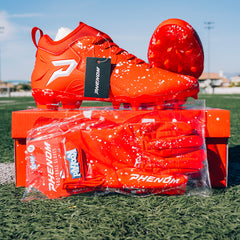 Phenom Elite Kool-Aid Cherry football cleat lifestyle photo — Kool-Aid Man and cleats