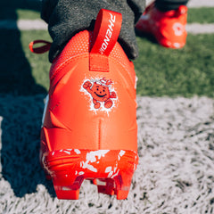 Phenom Elite Kool-Aid Cherry football cleat lifestyle photo — cleats with packet 2