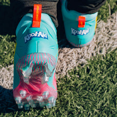 Phenom Elite Kool-Aid Sharkleberry Fin football cleat lifestyle photo — cleats with packet 3