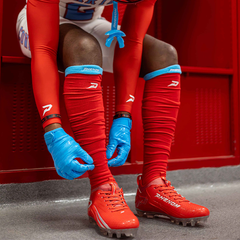 Phenom Elite Quantum Speed 2.0 red football cleat — on-field