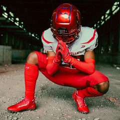 Phenom Elite Quantum Speed 2.0 red football cleat — on-field