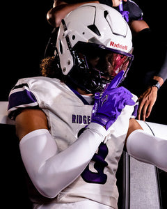 Phenom Elite Quantum Fierce purple padded football gloves on-field