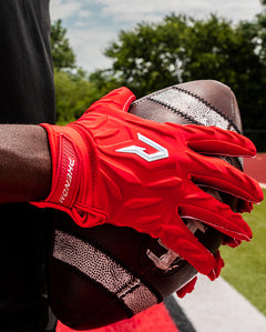 Phenom Elite Quantum Fierce red padded football gloves on-field