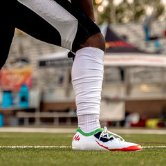 Phenom Elite Joker football cleat lifestyle photo — athlete wearing cleats