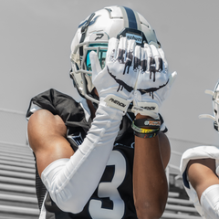 Phenom Elite Sinister VPS1 Vapor-Stick football gloves — lifestyle photo of athlete wearing Sinister gloves