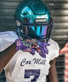 Phenom Elite x Scooby-Doo Unmasked VPS1 Vapor-Stick football gloves — lifestyle photo on field